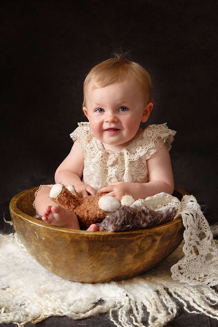 little girl in bowl - photos by Bradford Baby photography Leeds 