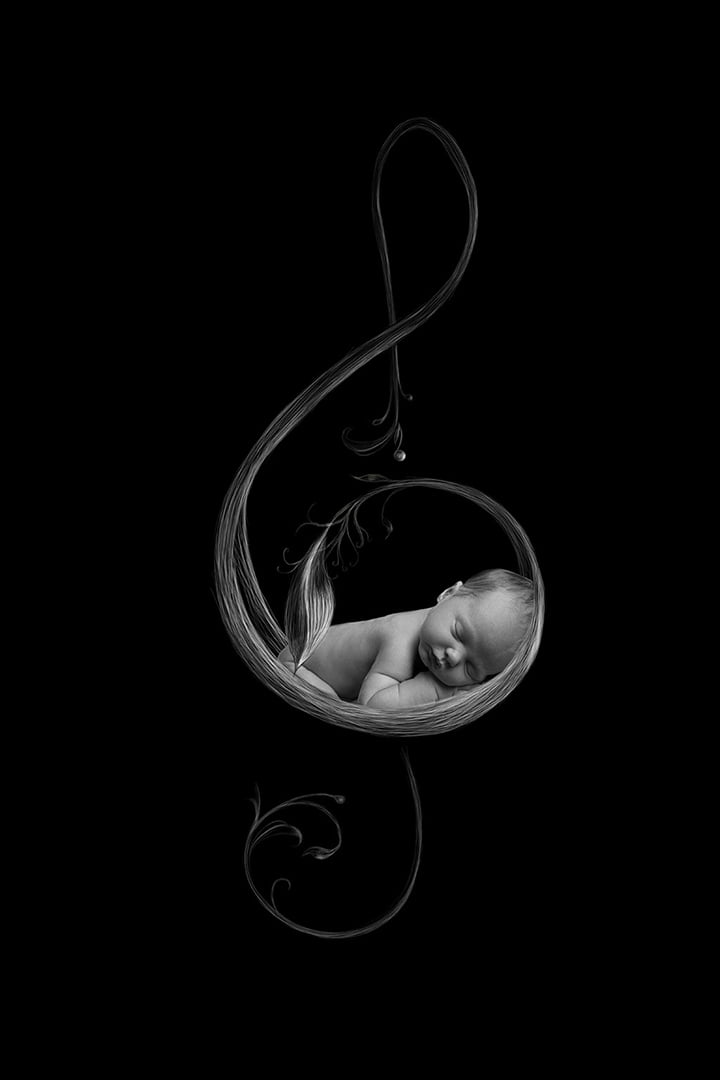 black and white portrait of baby in musical note by Newborn Photographer Bradford