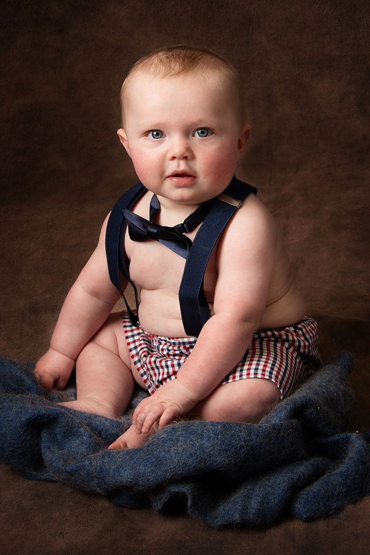 little boy in blue outfit taken by Baby photography Leeds 