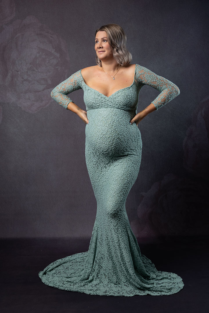 strong woman in green lace dress